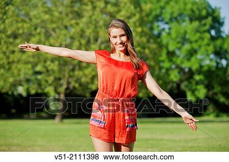 Brunette pretty woman in park smiling at camera View Large Photo Image Stock Photo - Brunette pretty woman in park smiling at camera. Fotosearch