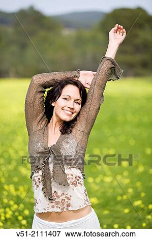 Brunette pretty woman in park smiling at camera View Large Photo Image Stock Photo - Brunette pretty woman in park smiling at camera. Fotosearch