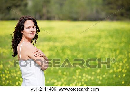 Brunette pretty woman in park smiling at camera View Large Photo Image Stock Photograph - Brunette pretty woman in park smiling at camera. Fotosearch