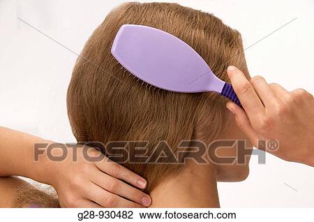 Brushing hair View Large Photo Image Stock Image - Brushing hair. Fotosearch