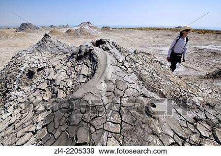 Stock Photo - Bubbling mud volcano. Azerbaijan, Qobustan. Model Released.. Fotosearch