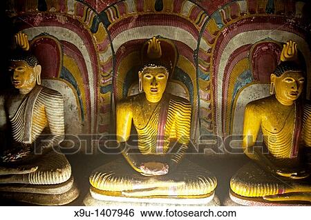 Stock Photograph - Buddha statues inside Dambulla cave temple complex in Sri Lanka. Fotosearch