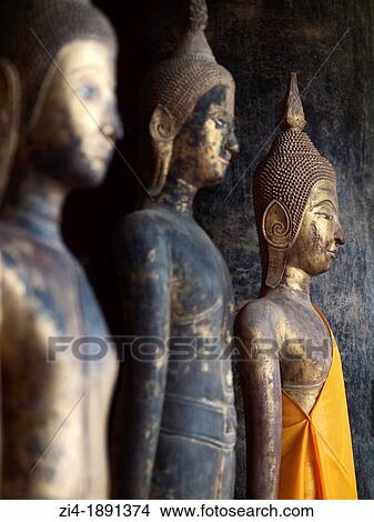 Picture - Buddha statues inside Vat Visounnarath in Luang Prabang Laos. Fotosearch
