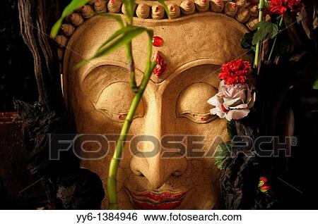 buddha stone image decorated with flowers, chinatown, bangkok, thailand View Large Photo Image Stock Photograph - buddha stone image decorated with flowers, chinatown, bangkok, thailand. Fotosearch