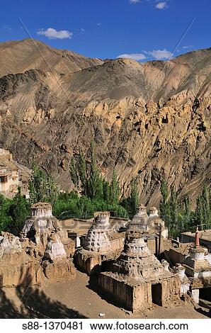 Stock Image - Buddhism stupas in the village at Lamayuru. Fotosearch