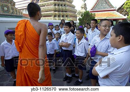 Buddhist monk talking to Thai school children, Wat Pho temple of the reclining buddha Bangkok, Thailand View Large Photo Image Stock Image - Buddhist monk talking to Thai school children, Wat Pho temple of the reclining buddha Bangkok, Thailand. Fotosearch