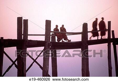 Buddhist monks crossing the U Bein's bridge at Amarapura, the longest teak footbridge in the world at 1. 2 km. Mandalay region, Myanmar View Large Photo Image Stock Photograph - Buddhist monks crossing the U Bein's bridge at Amarapura, the longest teak footbridge in the world at 1. 2 km. Mandalay region, Myanmar. Fotosearch