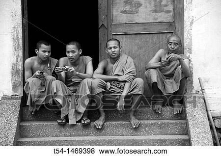 Buddhist Monks playing with Cellphones View Large Photo Image Stock Photo - Buddhist Monks playing with Cellphones. Fotosearch