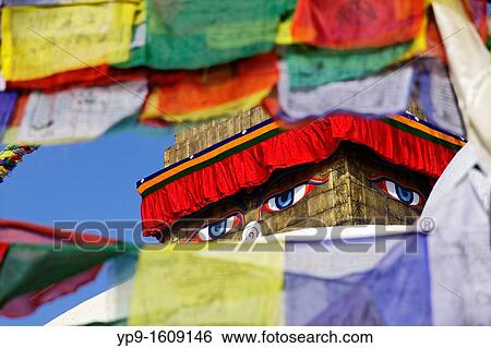 Stock Photograph - Buddhist stupa and prayer flags at Bodhnath, Kathmandu, Nepal. Fotosearch