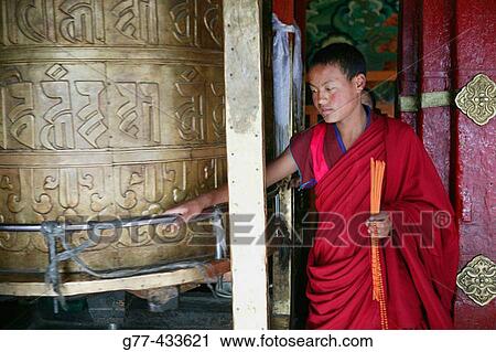 Stock Image - Buddhitst monk in Jokhang Monastery, Lhasa. Tibet. Fotosearch