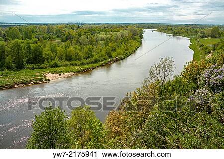 Bug river seen from Castle Hill in Drohiczyn, Podlasie region, Poland. View Large Photo Image Stock Image - Bug river seen from Castle Hill in Drohiczyn, Podlasie region, Poland.. Fotosearch
