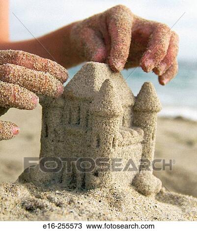 building a sand castle View Large Photo Image Stock Image - building a sand castle. Fotosearch