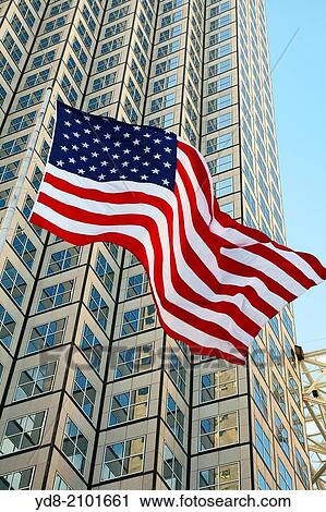 Stock Image - Building and American Flag Downtown Miami, Florida, USA. Fotosearch