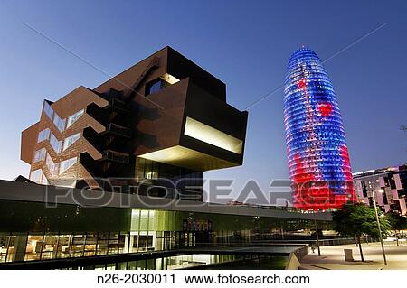 Stock Image - Building Design Hub Barcelona, by MBM architects. Agbar Tower, by Jean Nouvel. Barcelona.. Fotosearch
