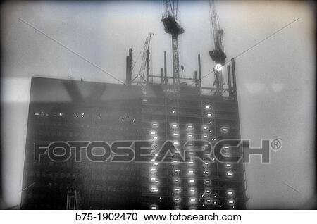 Building under construction with many cranes in the City of London, England, UK View Large Photo Image Stock Image - Building under construction with many cranes in the City of London, England, UK. Fotosearch