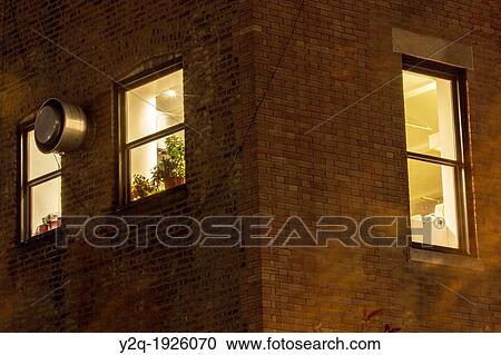 Stock Image - Building windows view from High Line Park in New York City, USA. Fotosearch