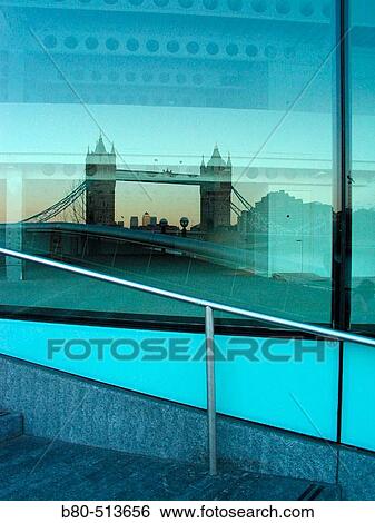Building with Tower Bridge reflected on, London. England, UK View Large Photo Image Stock Photograph - Building with Tower Bridge reflected on, London. England, UK. Fotosearch