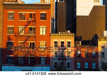 Buildings at sunset. New York City. NY, USA. View Large Photo Image Stock Photo - Buildings at sunset. New York City. NY, USA.. Fotosearch