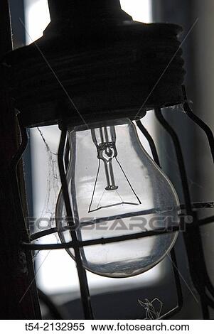 Bulb in a hand lamp View Large Photo Image Stock Photography - Bulb in a hand lamp. Fotosearch