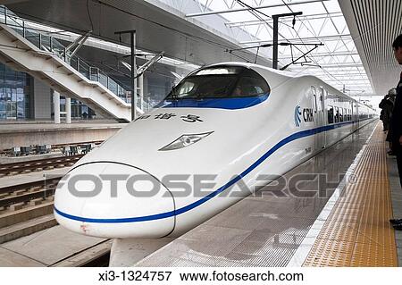 Bullet train in a railway station, China View Large Photo Image Stock Photo - Bullet train in a railway station, China. Fotosearch