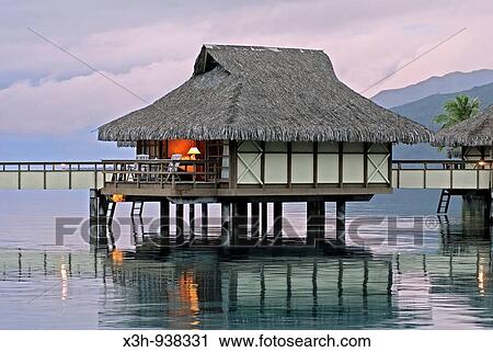 Stock Image - bungalows sur pilotis, hotel Sheraton Moorea, ile Moorea, iles de la Societe, archipel de la Polynesie francaise, ocean pacifique sud. Fotosearch