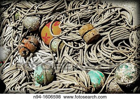 Stock Photo - Buoys, and fishing in the fishing port of the population The Puerto de la Selva, Girona, Spain.. Fotosearch