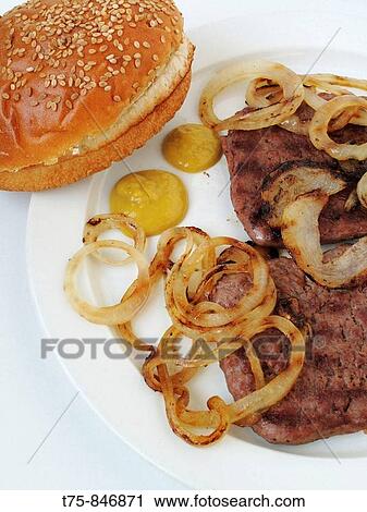 Burgers, onion rings, mustard and sesame bread View Large Photo Image Stock Image - Burgers, onion rings, mustard and sesame bread. Fotosearch