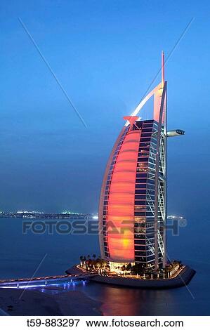 Stock Photo - Burj Al Arab Hotel at dusk, Dubai, United Arabian Emirates. Fotosearch