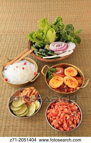 Burmese egg curry, rice noodles, salad, side dishes,. View Large Photo Image Picture - Burmese egg curry, rice noodles, salad, side dishes,.. Fotosearch
