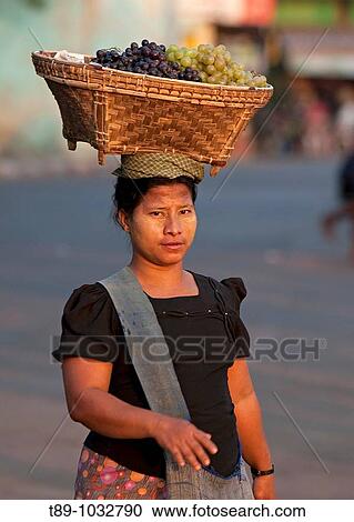 Burmese woman walking to the market with grapes. View Large Photo Image Stock Image - Burmese woman walking to the market with grapes.. Fotosearch