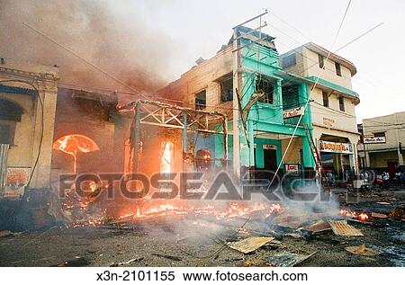 Stock Photography - Burning building in Haiti.. Fotosearch