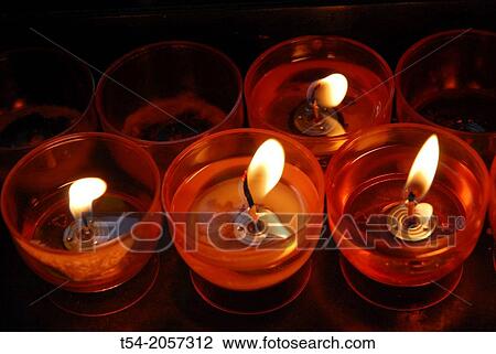 Burning candles in a church View Large Photo Image Stock Image - Burning candles in a church. Fotosearch