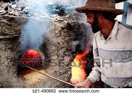 Stock Image - Burning ceramic tiles, at Hadj Driss Khomsi? zellige? factory, at A? n Nokbi, outside Fes. Morocco.. Fotosearch