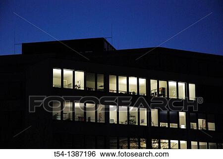 Burning lights in an office complex View Large Photo Image Stock Photograph - Burning lights in an office complex. Fotosearch
