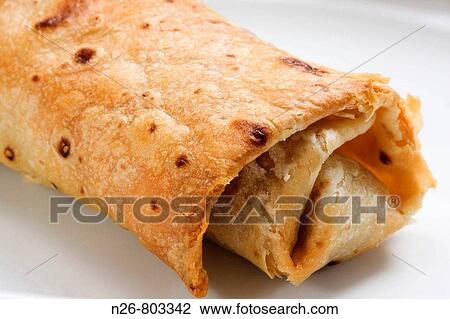 Burrito. Mexican dish. View Large Photo Image Stock Image - Burrito. Mexican dish.. Fotosearch