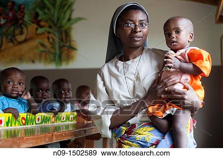 Burundi, nun with orphans View Large Photo Image Stock Photo - Burundi, nun with orphans. Fotosearch
