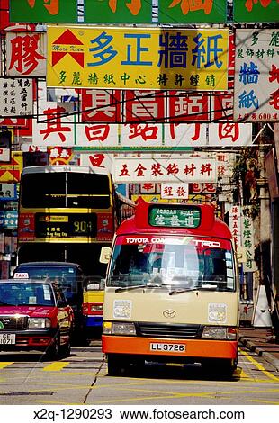 Bus and taxi waiting at an intersection in Kowloon Hong Kong View Large Photo Image Stock Image - Bus and taxi waiting at an intersection in Kowloon Hong Kong. Fotosearch