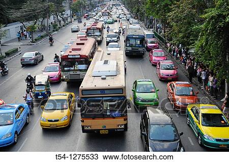 Bus is standing in a traffic jam in Bangkok View Large Photo Image Stock Image - Bus is standing in a traffic jam in Bangkok. Fotosearch