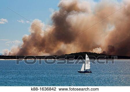 Stock Image - Bushfire opposite Noosa Heads Queensland, Australia. Fotosearch