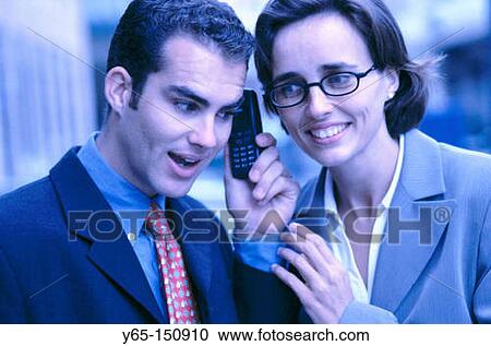 Business couple with cell phone View Large Photo Image Stock Image - Business couple with cell phone. Fotosearch