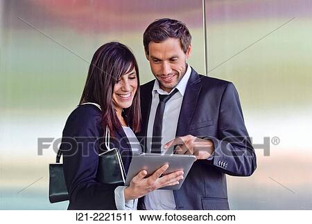 Business man and business woman with tablet. View Large Photo Image Stock Image - Business man and business woman with tablet.. Fotosearch