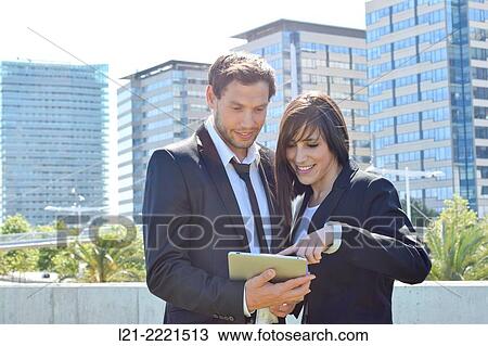 Business man and business woman with tablet. View Large Photo Image Stock Image - Business man and business woman with tablet.. Fotosearch