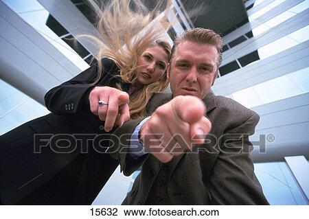 Business man and woman leaning over View Large Photo Image Stock Image - Business man and woman leaning over. Fotosearch