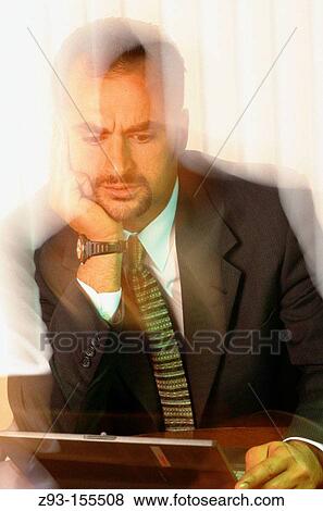 Business man in office View Large Photo Image Stock Photo - Business man in office. Fotosearch