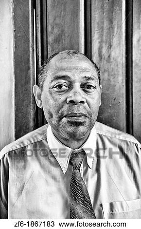 Business man in tie in front of door in central Havana Habana Cuba View Large Photo Image Stock Image - Business man in tie in front of door in central Havana Habana Cuba. Fotosearch