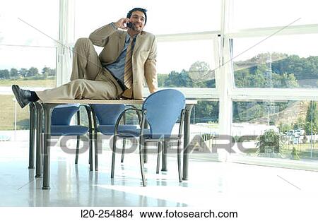 Business man on cell phone View Large Photo Image Picture - Business man on cell phone. Fotosearch