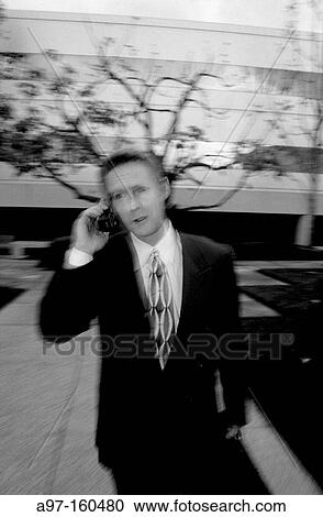 Business man on cell phone View Large Photo Image Stock Image - Business man on cell phone. Fotosearch