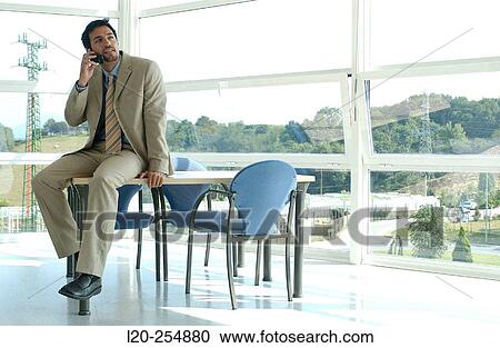 Business man on cell phone View Large Photo Image Stock Image - Business man on cell phone. Fotosearch