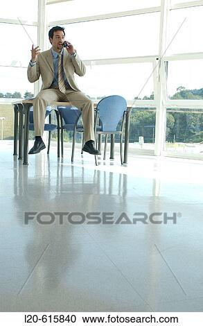 Business man on cell phone View Large Photo Image Stock Image - Business man on cell phone. Fotosearch