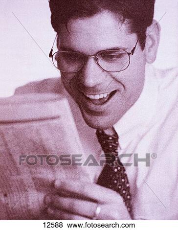 Business man reads newspaper View Large Photo Image Stock Photo - Business man reads newspaper. Fotosearch